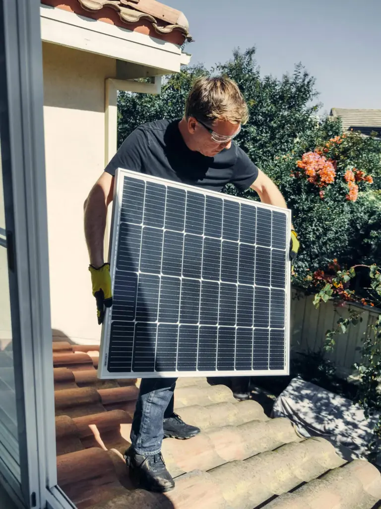 A man installing his solar panels without using experts